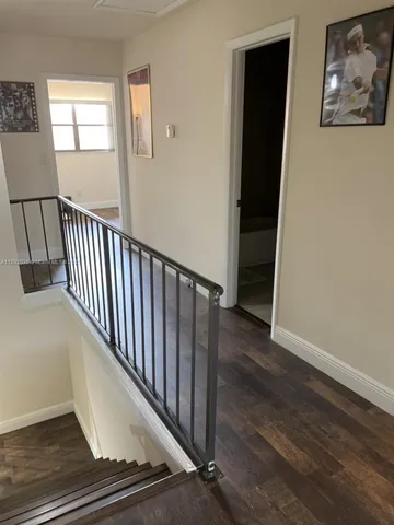 a living room with a couch and a window