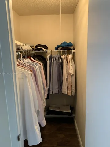 an entryway door with wooden floor and a sink