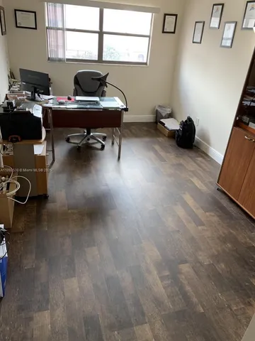 a view of a hallway with a window