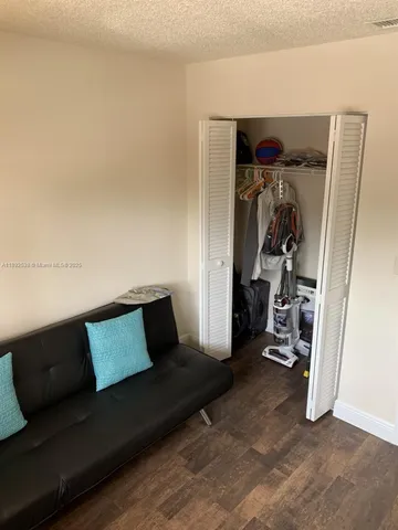 a view of an empty room and wooden floor