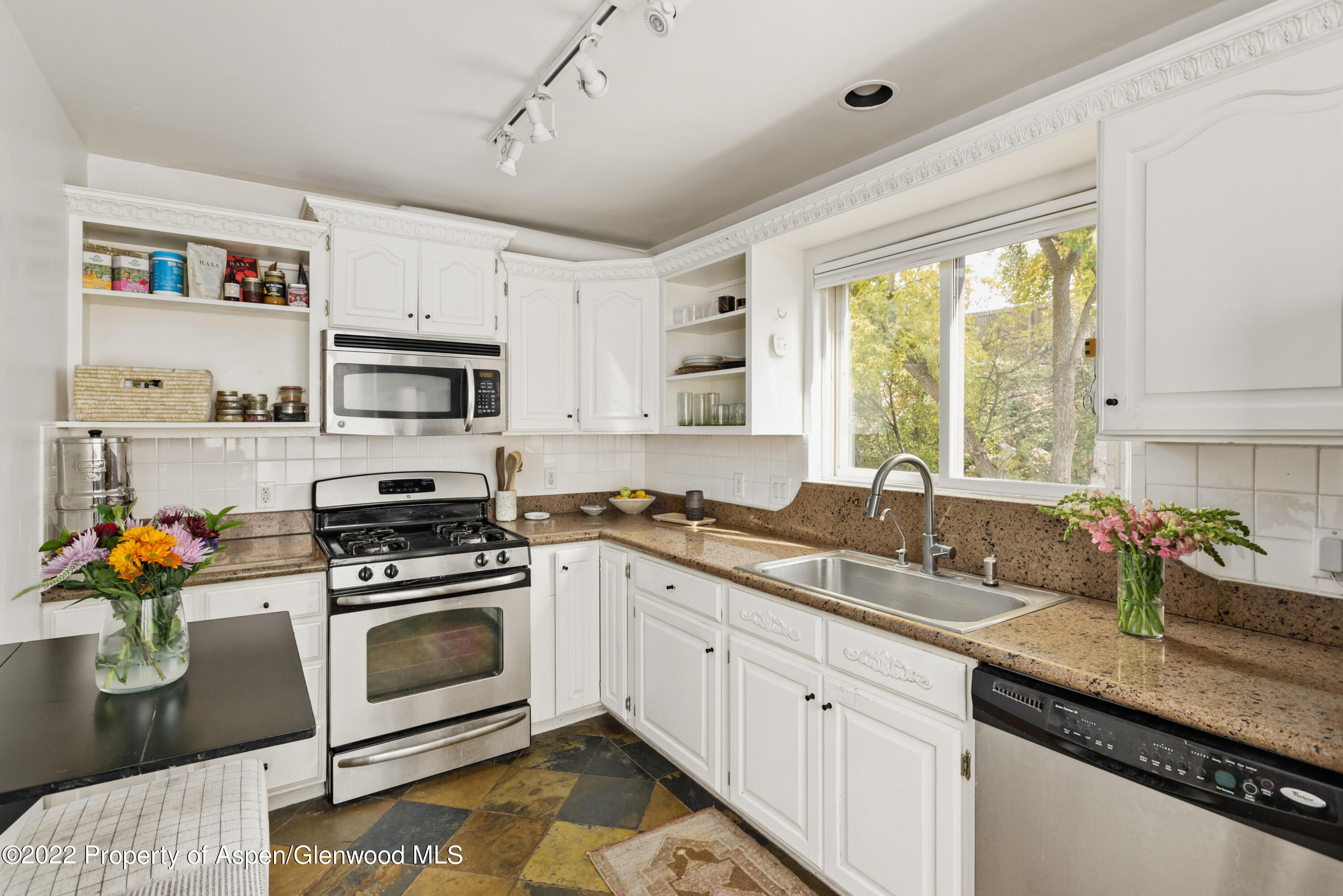 123 Swinging Bridge Lane Basalt, CO 81621 - Photo 8 of 15 a kitchen with stainless steel appliances granite countertop a sink a stove a microwave a refrigerator and cabinets