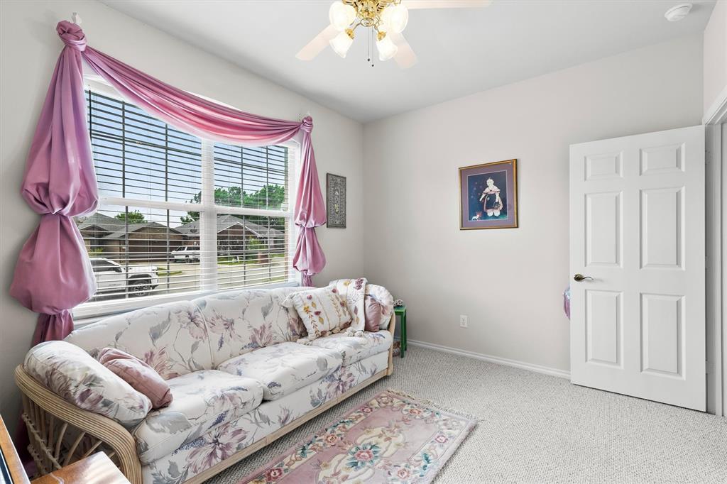 3505 Austin Street Gainesville, TX 76240 - Photo 15 of 20 a bed room with a bed and a couch