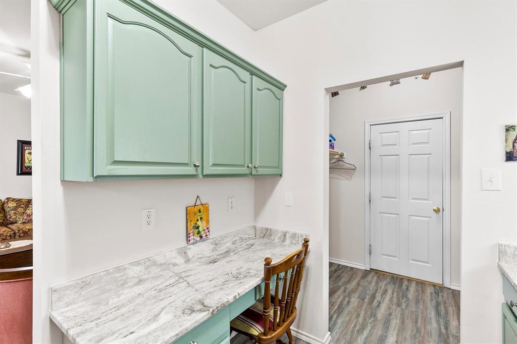 3505 Austin Street Gainesville, TX 76240 - Photo 5 of 20 a kitchen with a refrigerator a stove and cabinets