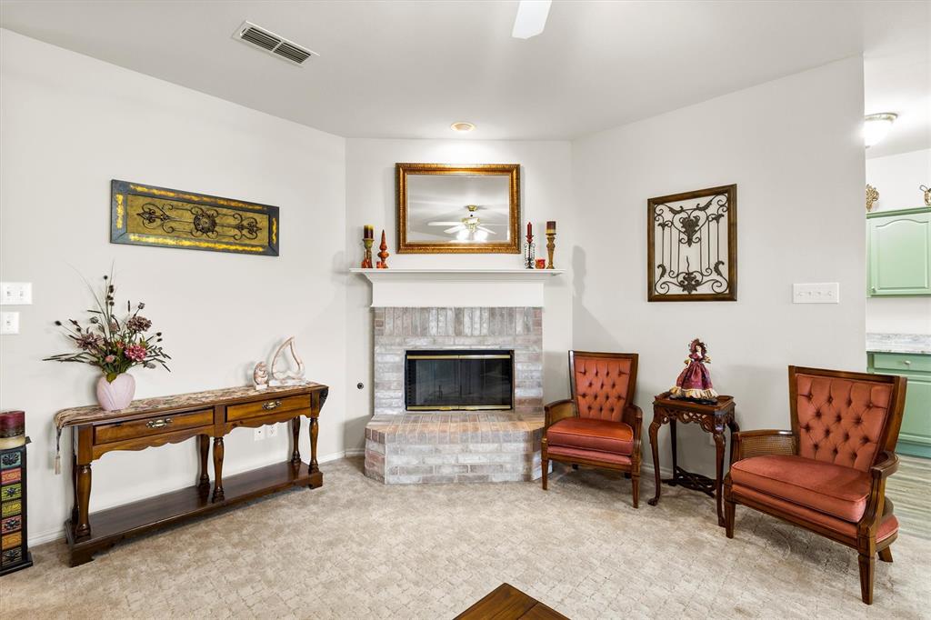 3505 Austin Street Gainesville, TX 76240 - Photo 7 of 20 a living room with furniture and a fireplace