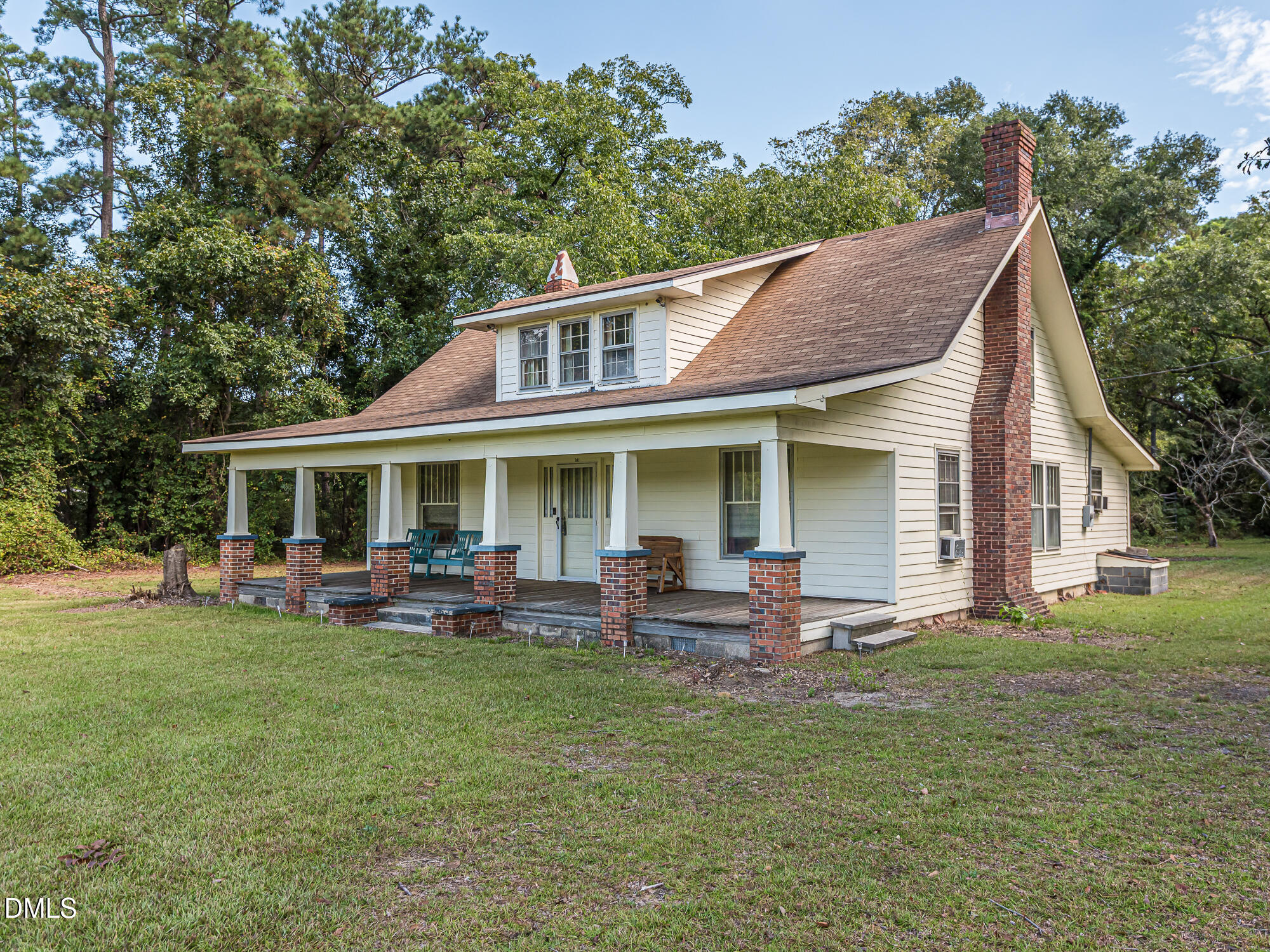 a view of a house with a yard porch and sitting area