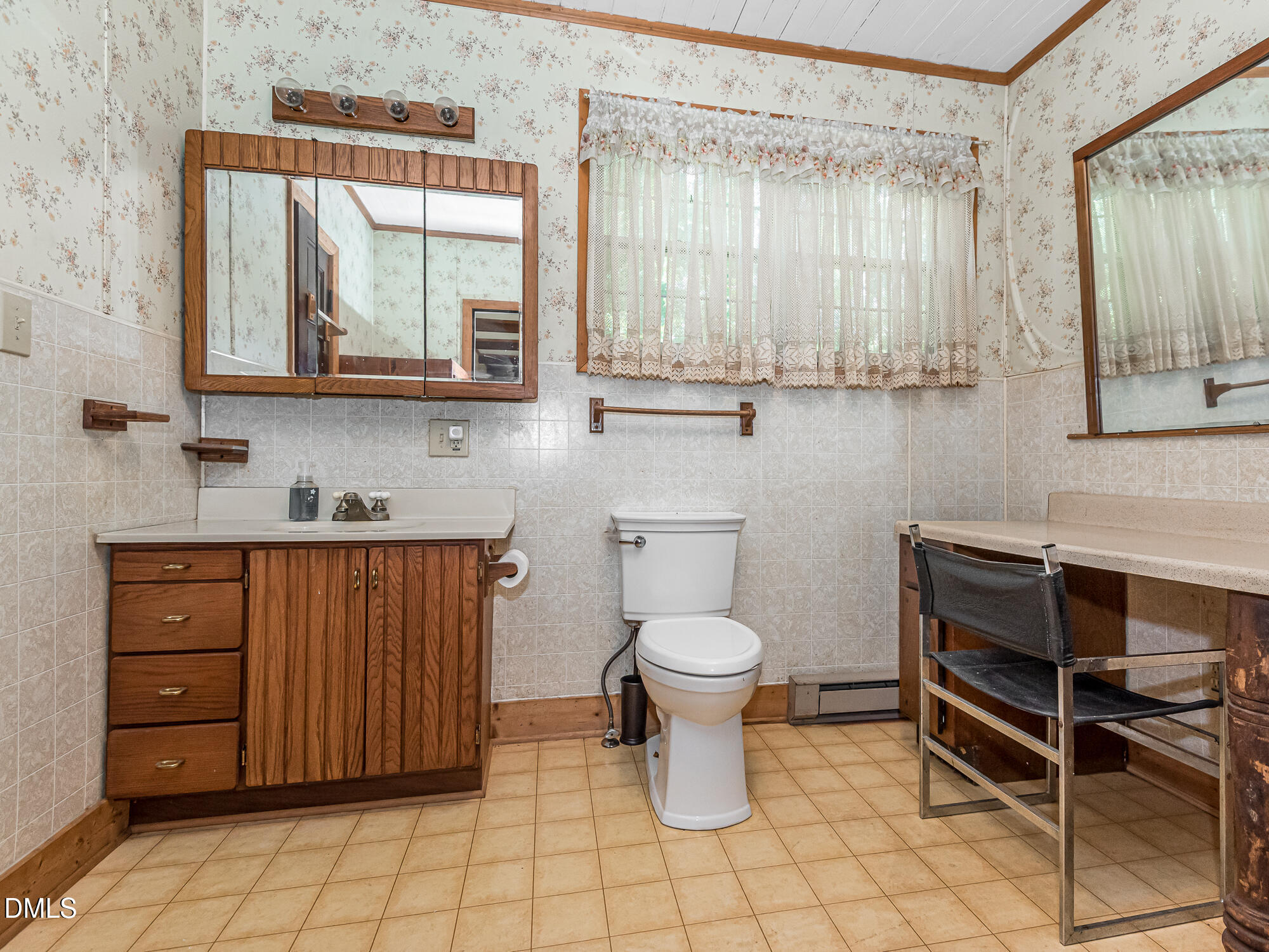 381 Royal Road Roseboro, NC 28382 - Photo 26 of 30 a bathroom with a toilet a sink and a mirror