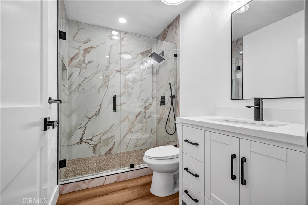 1200 South Castlegate Avenue Compton, CA 90221 - Photo 20 of 39 a bathroom with a shower a toilet and a sink