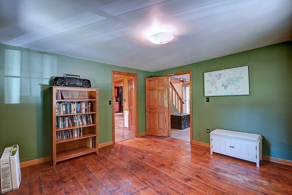 176 Corbin Road Dudley, MA 01571 - Photo 10 of 41 a view of a livingroom with toys and a bookshelf