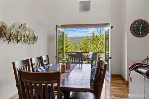 a view of a dining room with furniture window and outside view