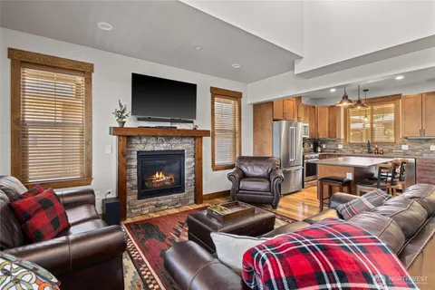 a living room with furniture fireplace and flat screen tv