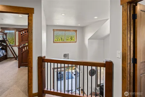 a view of a hallway with windows