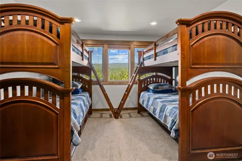 a view of a bedroom with windows