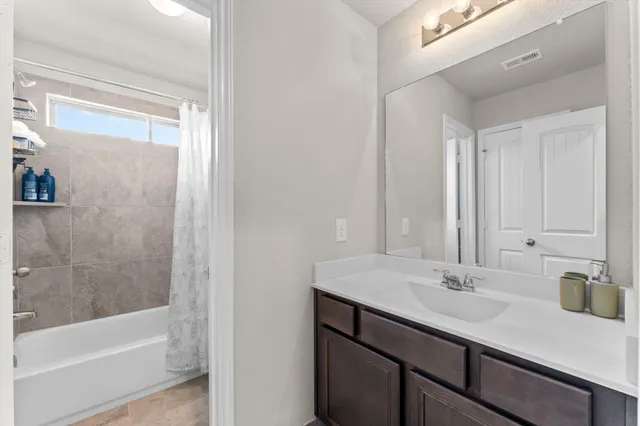 a bathroom with a sink and a bathtub