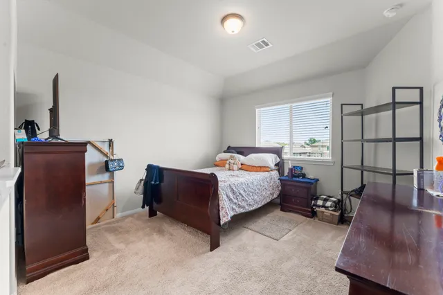 a bedroom with a bed and furniture