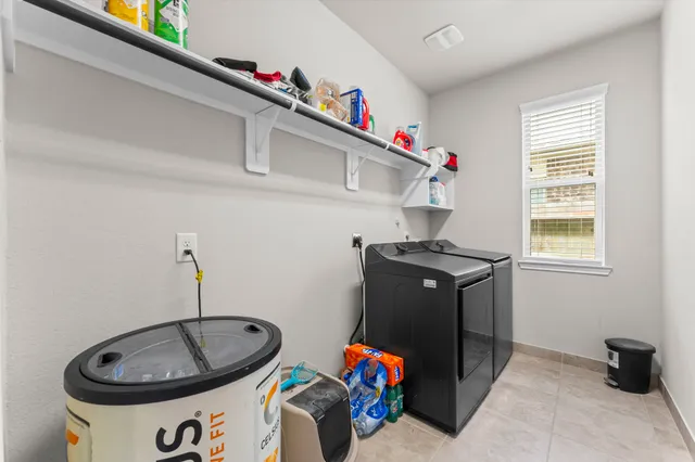 a utility room with dryer and washer
