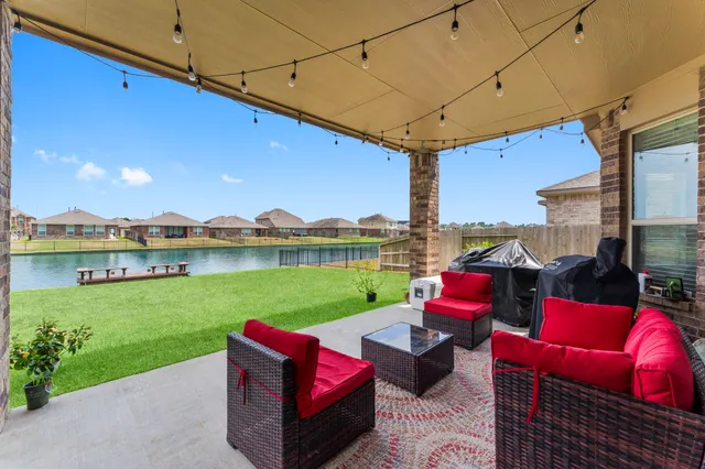 a view of a deck with couches table and chairs