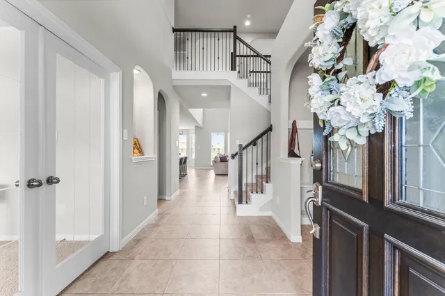 a view of entryway and hall with a front door