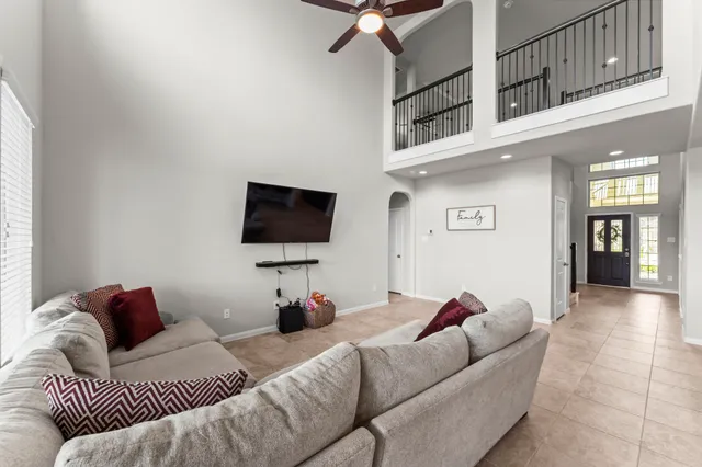 a living room with furniture and a flat screen tv
