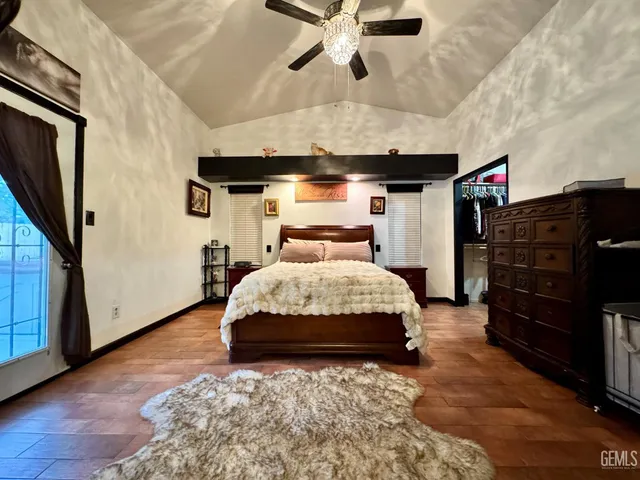 a bedroom with a bed and a tv