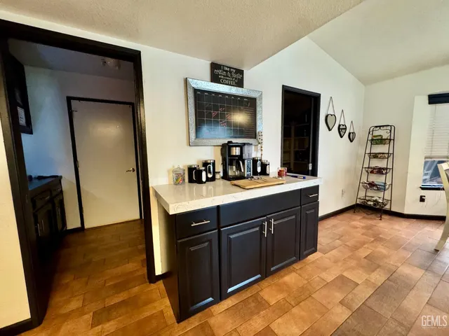 a spacious bathroom with a double vanity sink and a mirror