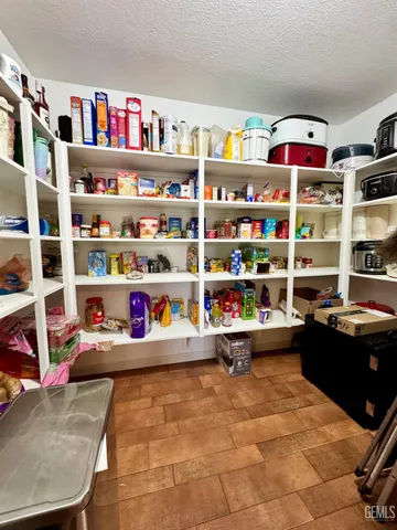a room with furniture toys and a book shelf