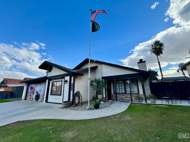 a view of house with swimming pool outdoor seating
