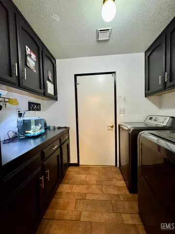 a bedroom with a bed and cabinets