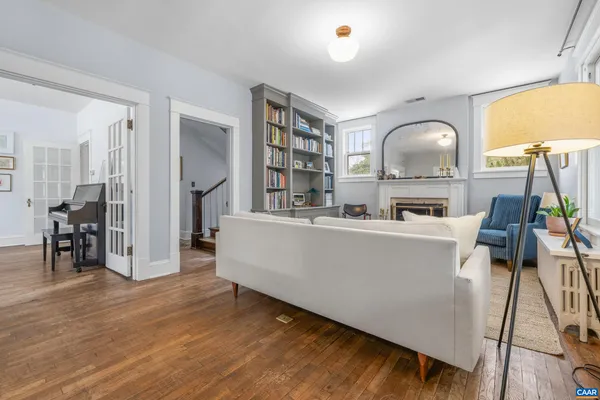 a living room with furniture and a fireplace
