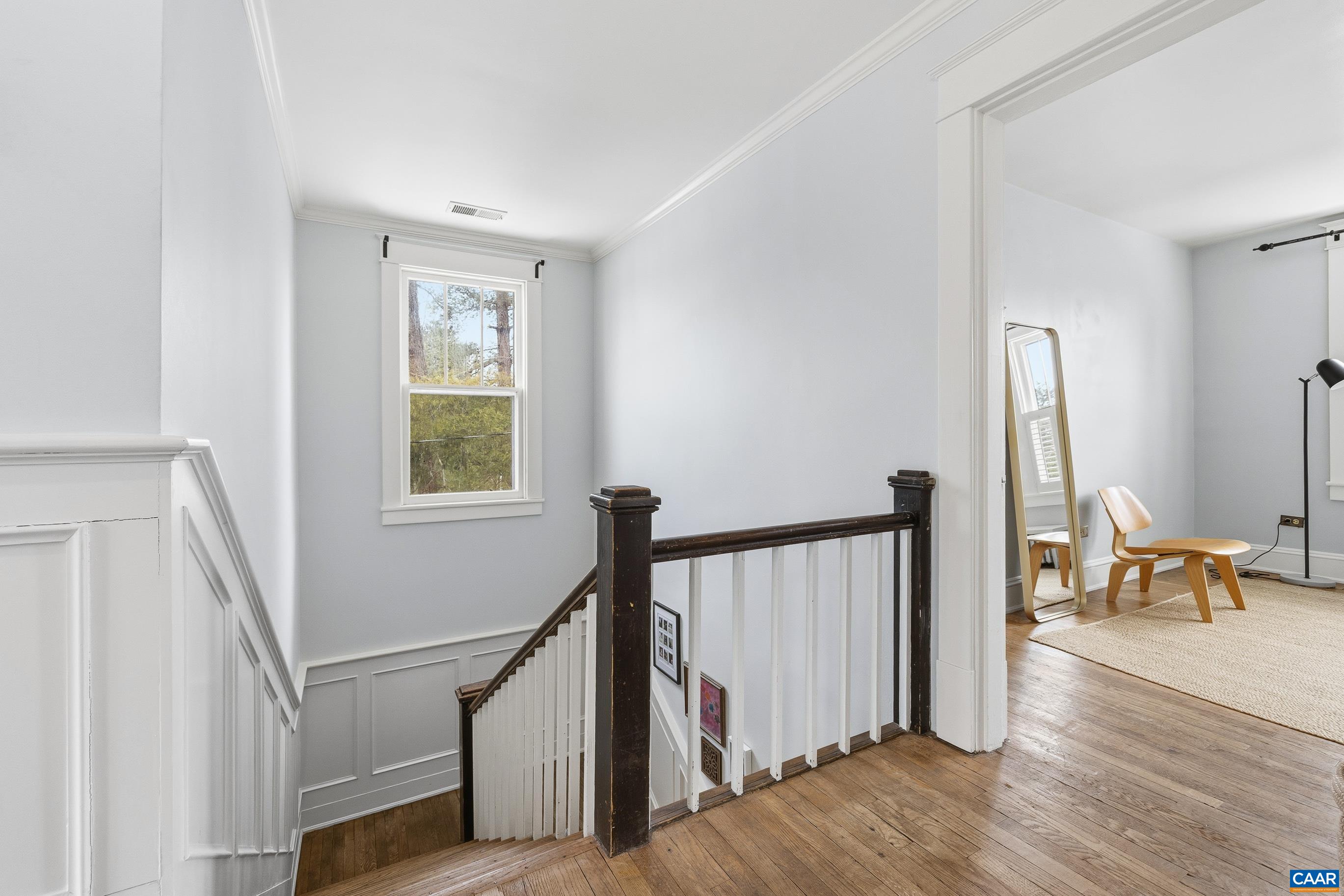 3 Buck Mountain Road Earlysville, VA 22936 - Photo 23 of 48 a view of a hallway with wooden floor and staircase