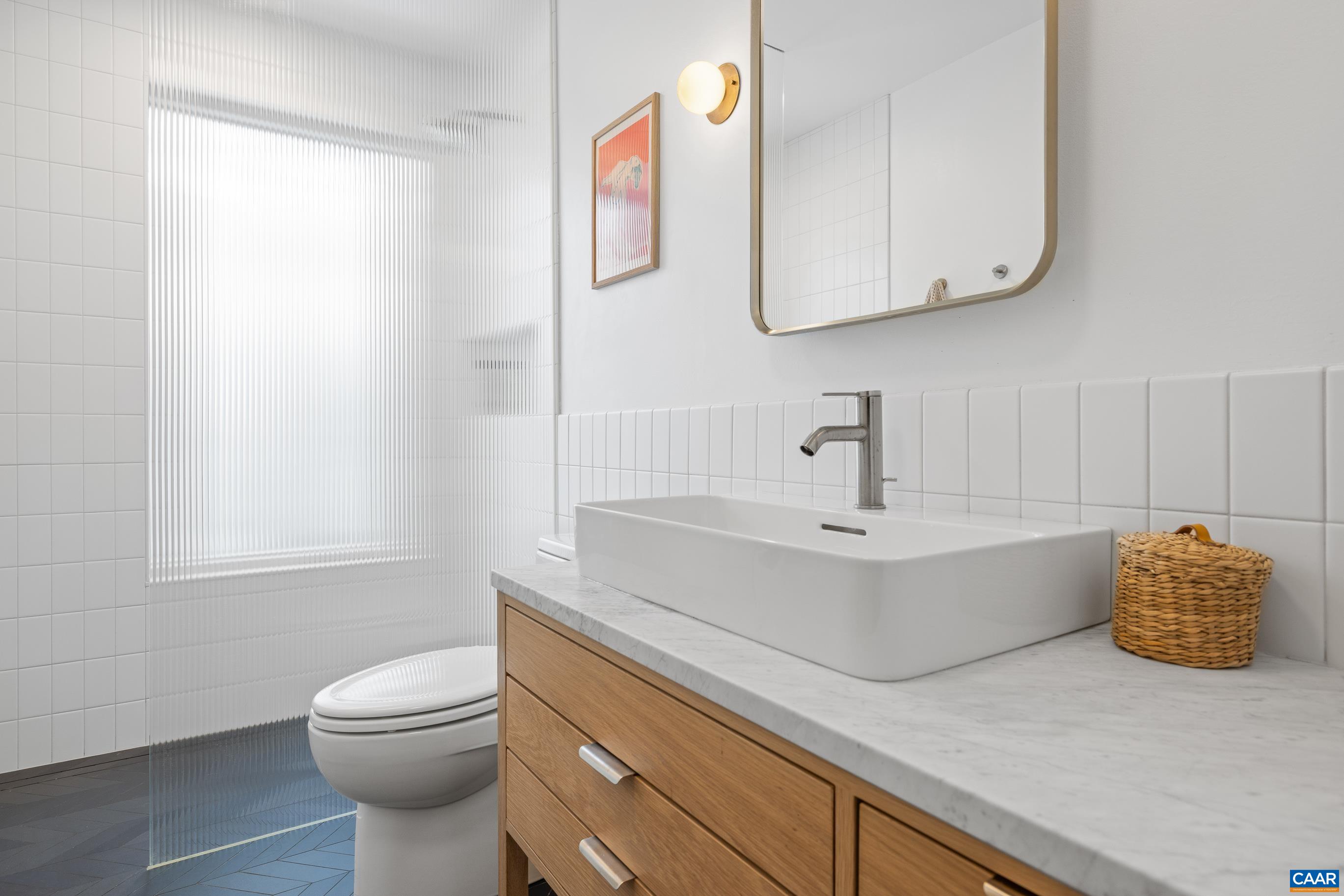 3 Buck Mountain Road Earlysville, VA 22936 - Photo 28 of 48 a bathroom with a sink a toilet and mirror