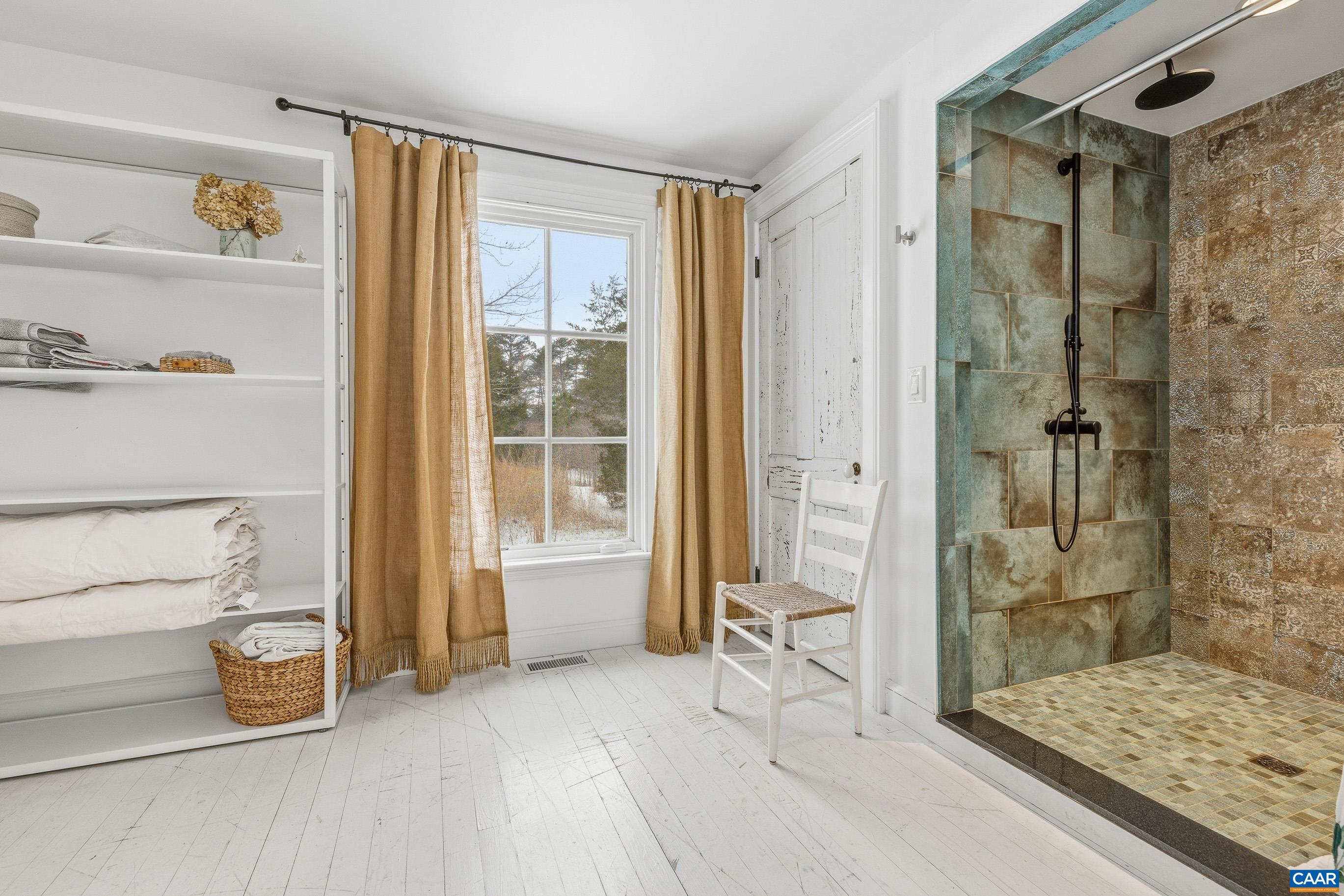 3 Buck Mountain Road Earlysville, VA 22936 - Photo 33 of 48 a bathroom with a tub and shower