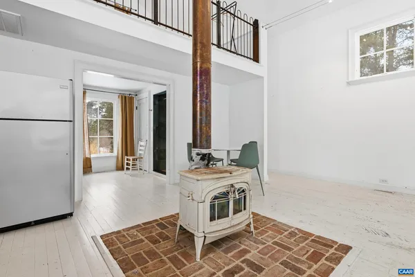 a living room with a couch and large window