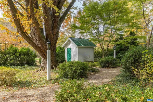 a view of residential house with green space