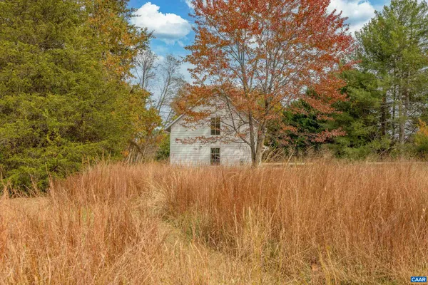 a view of a balcony with wooden floor