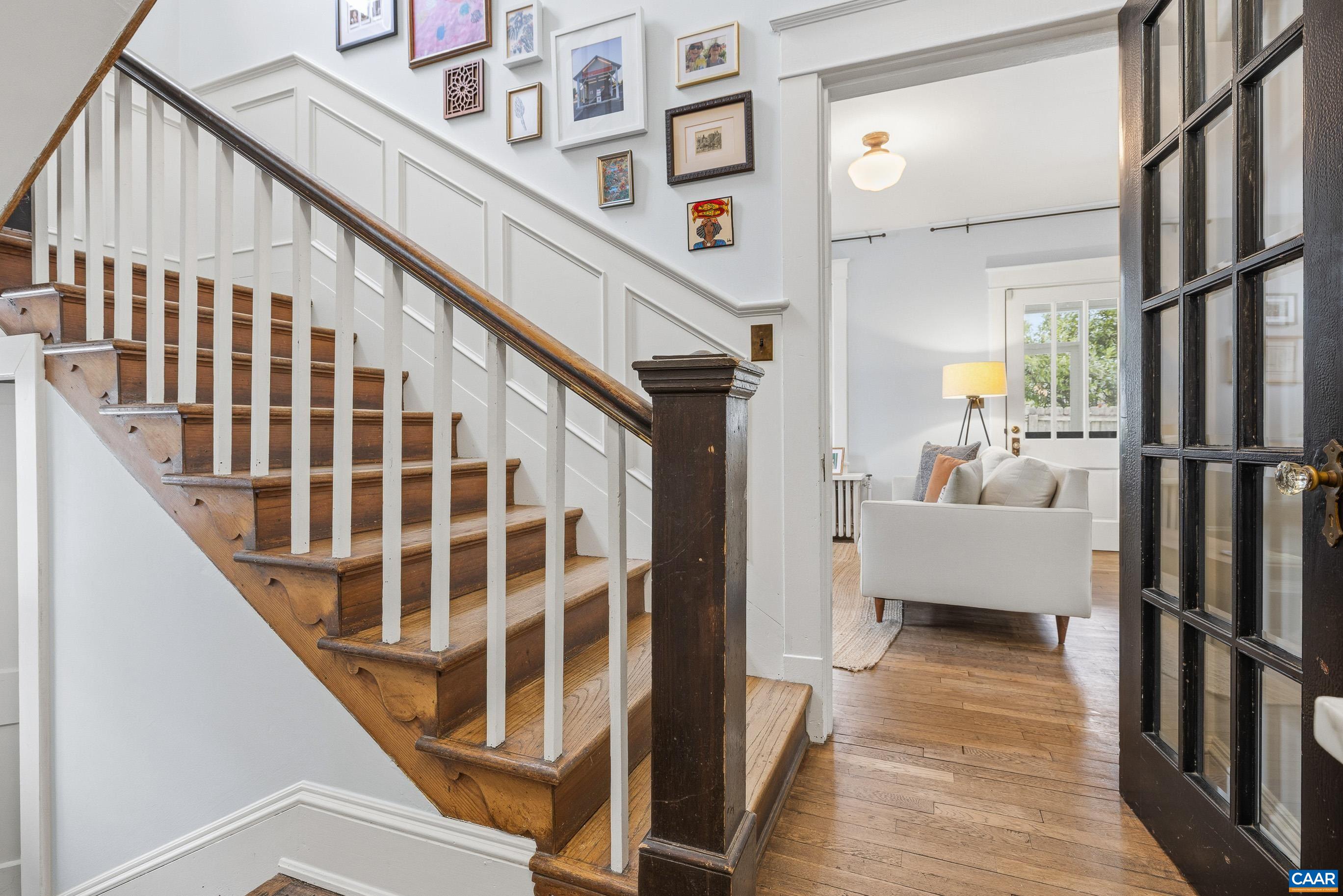 3 Buck Mountain Road Earlysville, VA 22936 - Photo 5 of 48 a view of staircase with lots of frames on wall and a glass door
