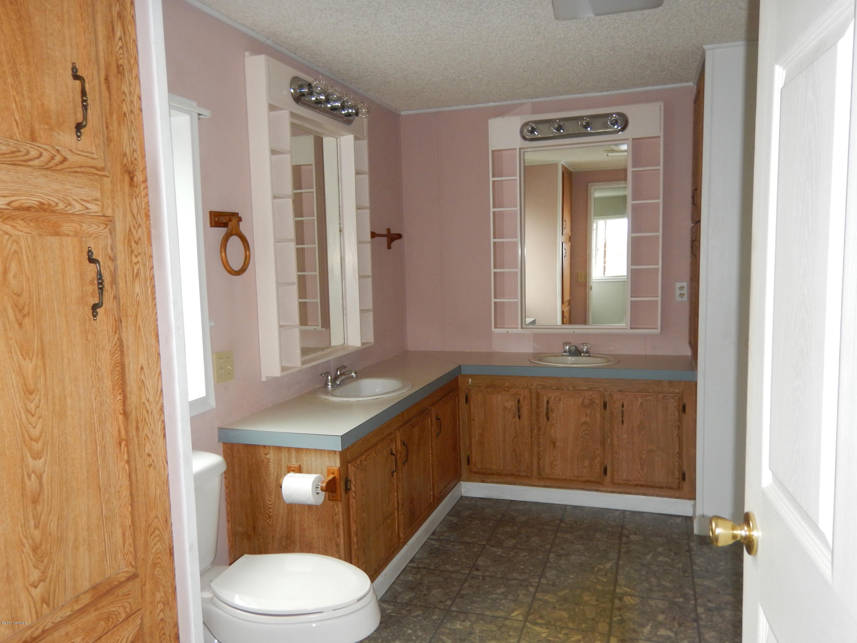 3404 South Stanton Road Yakima, WA 98903 - Photo 14 of 22 a bathroom with a granite countertop sink toilet and shower