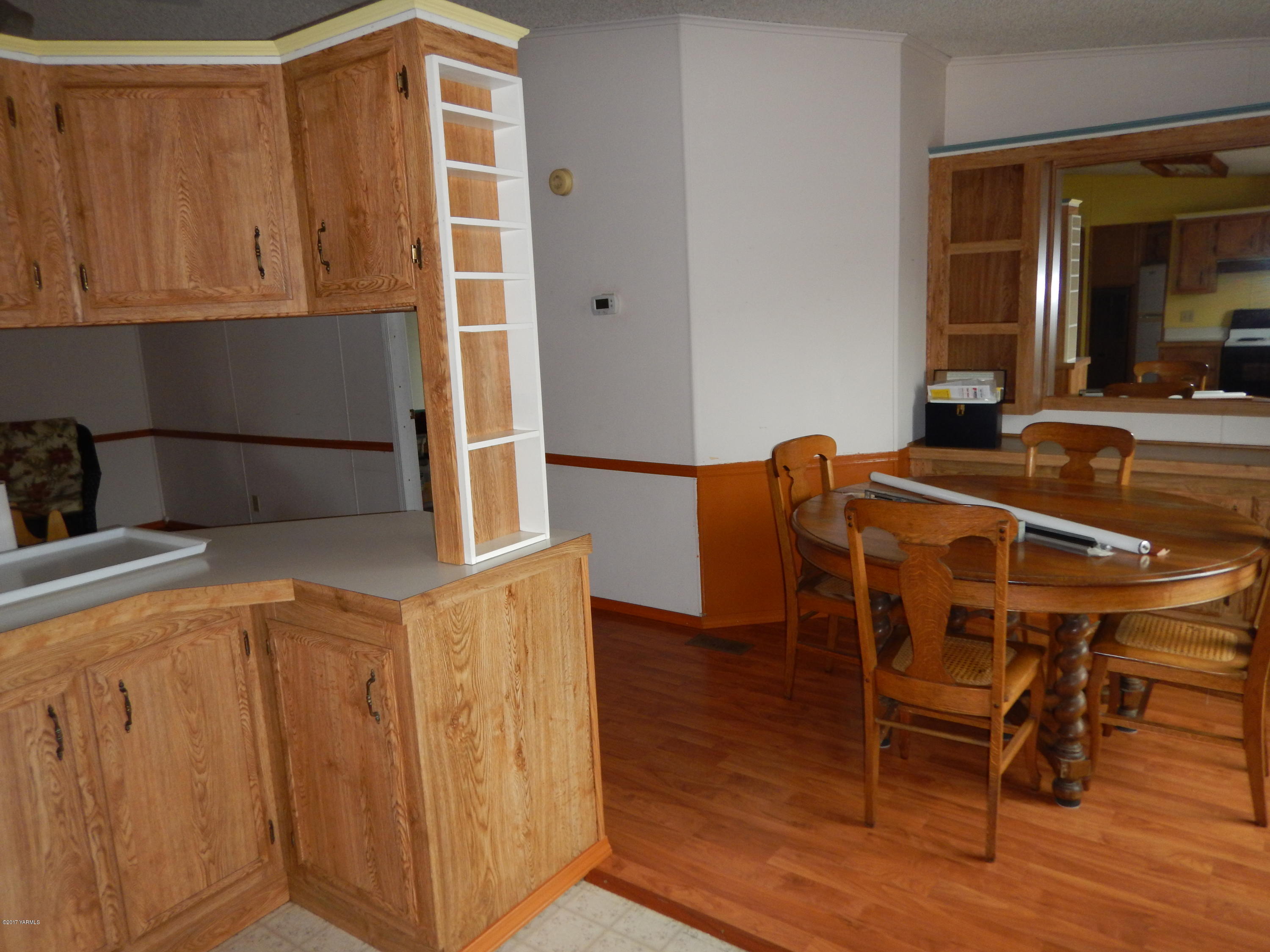 3404 South Stanton Road Yakima, WA 98903 - Photo 9 of 22 a dining room with furniture and wooden floor