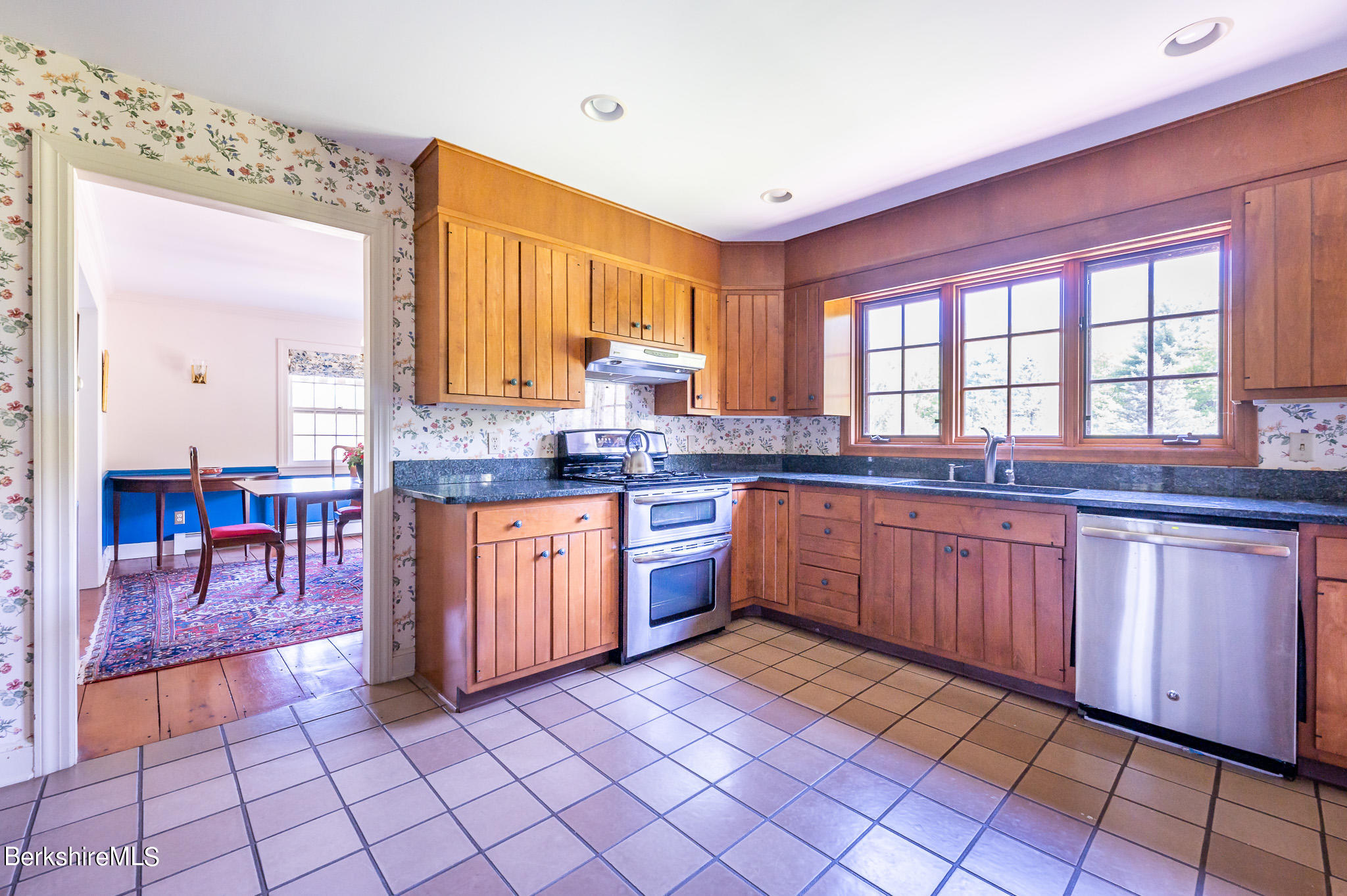 365 State Road Great Barrington, MA 01230 - Photo 11 of 34 a kitchen with stainless steel appliances granite countertop a stove a sink and a microwave