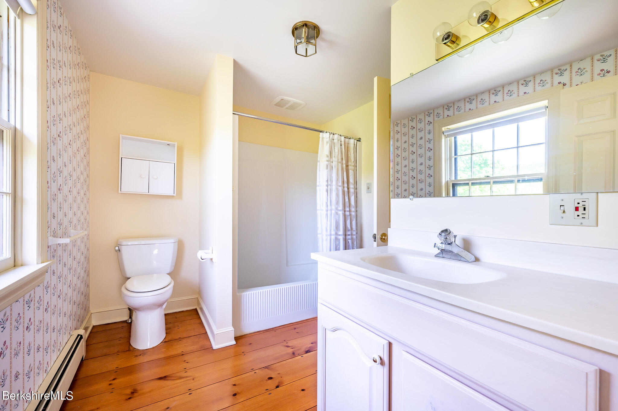 365 State Road Great Barrington, MA 01230 - Photo 19 of 34 a bathroom with a sink a toilet and a window