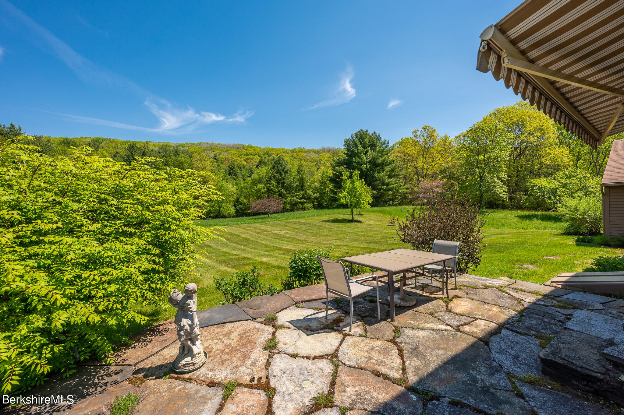 365 State Road Great Barrington, MA 01230 - Photo 24 of 34 a view of a patio with table and chairs with wooden fence