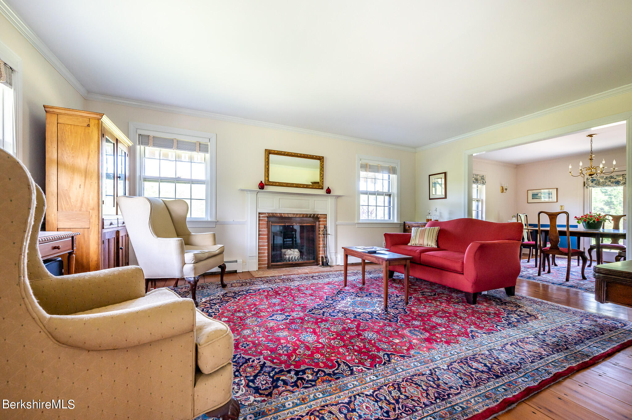 365 State Road Great Barrington, MA 01230 - Photo 8 of 34 a living room with furniture a rug a fireplace and windows
