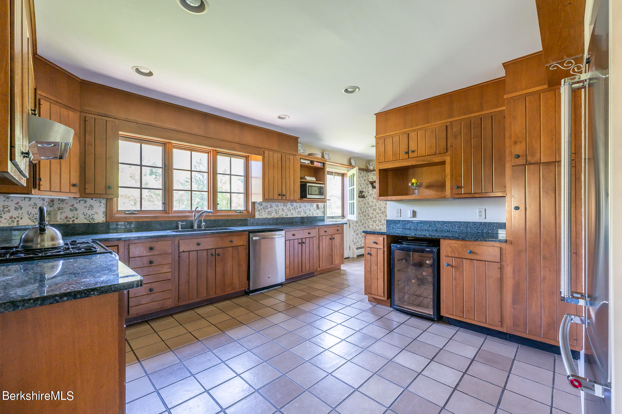 365 State Road Great Barrington, MA 01230 - Photo 10 of 34 a kitchen with stainless steel appliances granite countertop a stove a sink and a microwave