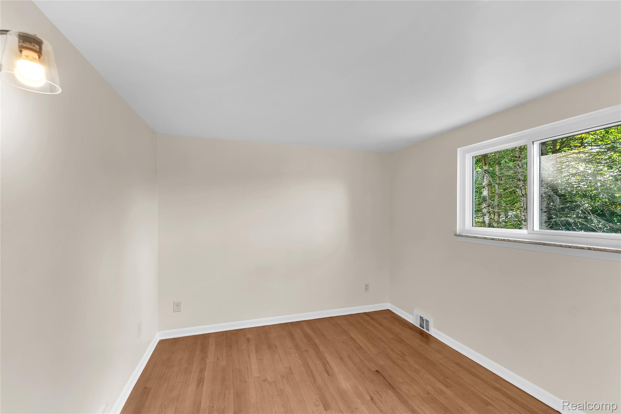 54011 Mound Road Utica, MI 48316 - Photo 18 of 27 Unfurnished room with light wood finished floors and baseboards