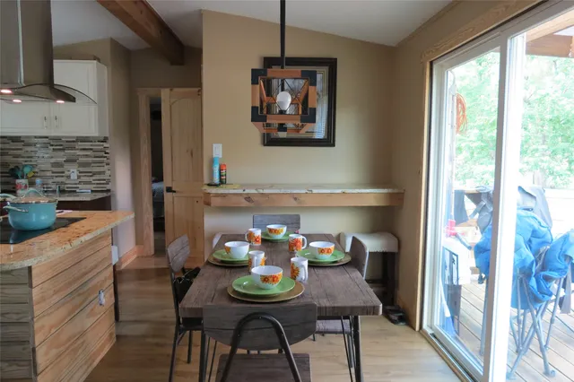a view of a dining room with furniture window and outside view