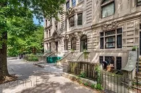 a view of a brick building with many windows