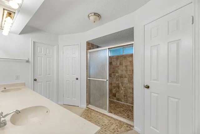 a bathroom with a bathtub and a shower