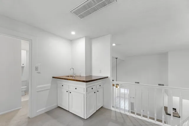 a view of a ceiling fan and a window