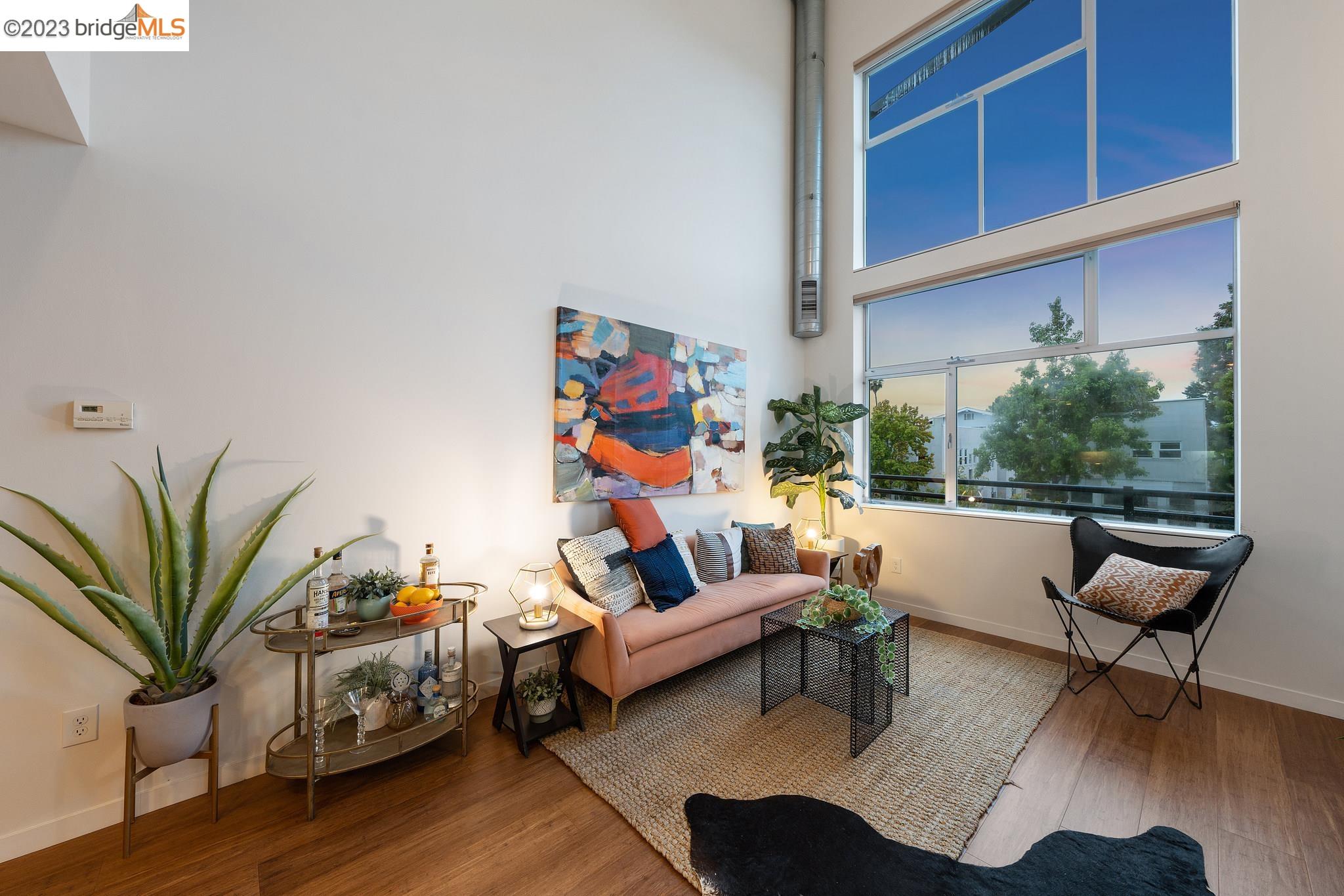 2400 Dowling Place, Unit 3 Berkeley, CA 94705 - Photo 1 of 1 a living room with furniture and a potted plant