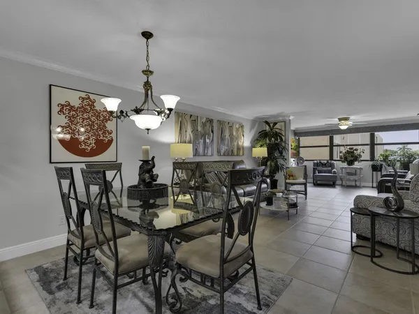 a view of a dining room that has a table and chairs