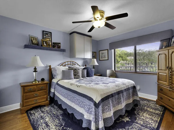 a bed room with a bed and a chandelier